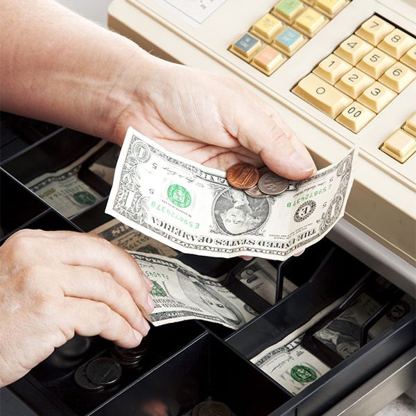 Blog featured image: Targeting Shrinkage - Ecentric on Cash Register Theft. Image of hands exchangeing money in a cash register.